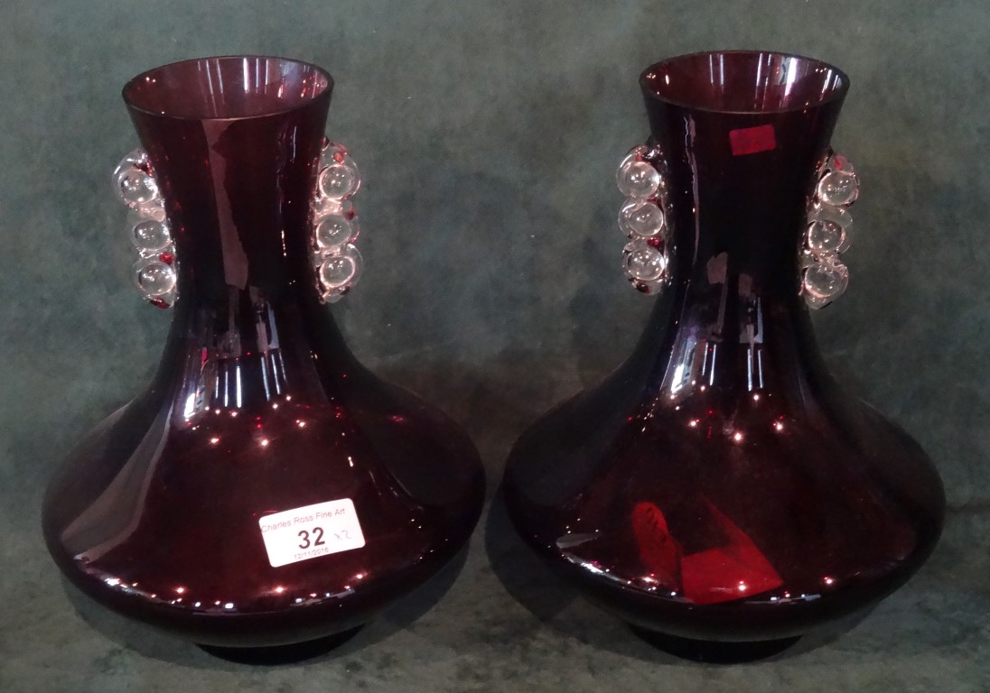 A pair of contemporary amethyst coloured vases (25cm).