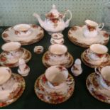A Royal Albert Country Roses tea service, a six place setting, comprising: teapot, trios, cruets,