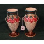 A pair of late 19th century Minton twin handled pedestal vases,