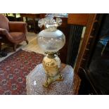 A Victorian oil lamp in the Aesthetic manner,