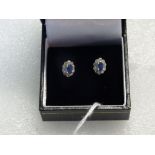 A pair of sapphire and diamond cluster earrings,