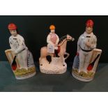 A pair of Staffordshire flatback cricketer figurines,