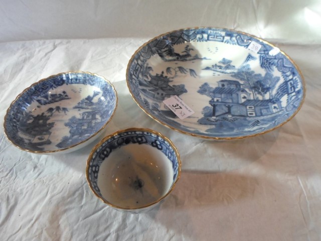 Three blue and white and gilt rimmed bowls,