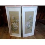 A pair of Japanese paintings on silk (46cm x 18cm), glazed in wooden frame.