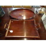 An Edwardian mahogany and inlaid oval twin handled tray,