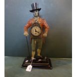 A novelty mantle clock, modelled as a Victorian gentleman in a top hat (41cm).