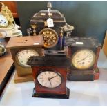 A Victorian slate mantle clock, together with another smaller and two further mantle clocks.