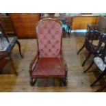 A mahogany framed pink upholstered rocking chair (65cm wide).