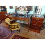 An early 20th century two drawer writing table,