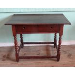 A mid-19th century oak single drawer side table (92cm x 57cm).