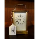 A French gilt brass carriage clock, single barrel movement, having five bevel edged glass panels,