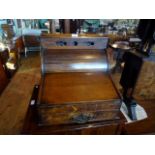 An early 20th century oak tambour fronted stationery box/writing slope,