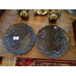 A pair of Oriental bronze dishes, each with scalloped edge borders,