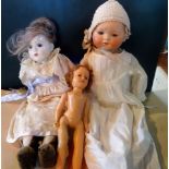 An early 20th century porcelain doll,