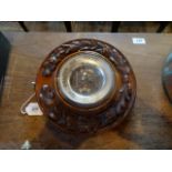 A oak framed circular wall barometer (26cm diameter).