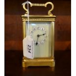 A French gilt brass carriage clock, single barrel movement, having five bevel edged glass panels,