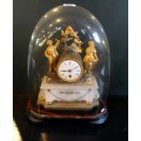 A French onyx and ormolu mounted mantle clock on stand and under dome,