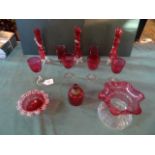 A quantity of Victorian and later cranberry coloured glass, to include: stem vases,
