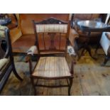 An Edwardian mahogany salon armchair (50cm wide).