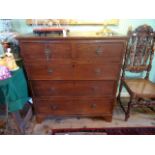 An oak chest, having two short over three graduated drawers on bracket feet (97cm).