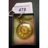 An 18ct gold lady's open faced fob watch, having chased decoration to the back plate and body.