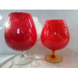 Two oversized ruby glasses (the largest 28cm).