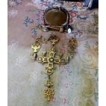 A brass table top dinner gong, together with Continental brass religious candle holder.
