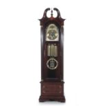 Howard Miller mahogany tall case clock three-weight chiming mechanism; H86" W26" D14 1/2"