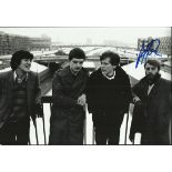 Peter Hook signed black and white Joy Division 8x12 photograph. Good condition. All signed items