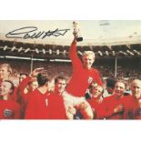 Perfect condition 8x6 colour card of Bobby Moore being held aloft by his team mates after winning
