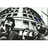 Peter Hook signed black and white Joy Division 8x12 photograph.  Good condition. All signed items