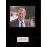 Midsomer Murders - John Nettles. Signature mounted with picture in character from ëMidsomer Murders.