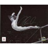Nadia Comaneci: Stunning 8x10 inch photo hand signed by Nadia Comaneci. This is an official 2012