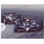 Mario Andretti. 10x8 picture racing in F1 car. Excellent. Good condition. All signed items come with