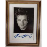 Ewan Mcgregor signed small b/w photo. Framed. Approx overall size 20cm x 14 cm.  Good condition.