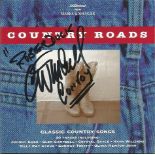 C W McCall autographed CD. CD of Country Roads - Classic Country Songs signed on the front of the