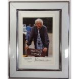 Michael Winner signed and dedicated small colour photo. Framed. Approx overall size 22cm x 17cm.