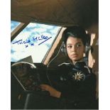 Tricia Muller autographed 8x10 colour photo of her as Sydney - Pussy Galore’s co-pilot in