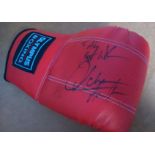 Autographed Boxing glove. Red Olympus training glove with an unidentified boxing autograph in