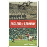 England v Germany softback book - The Best of Enemies - signed on front cover by Bobby Charlton.