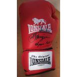 Joe Frazier autographed boxing glove. Red Lonsdale full size 16oz boxing glove autographed by former