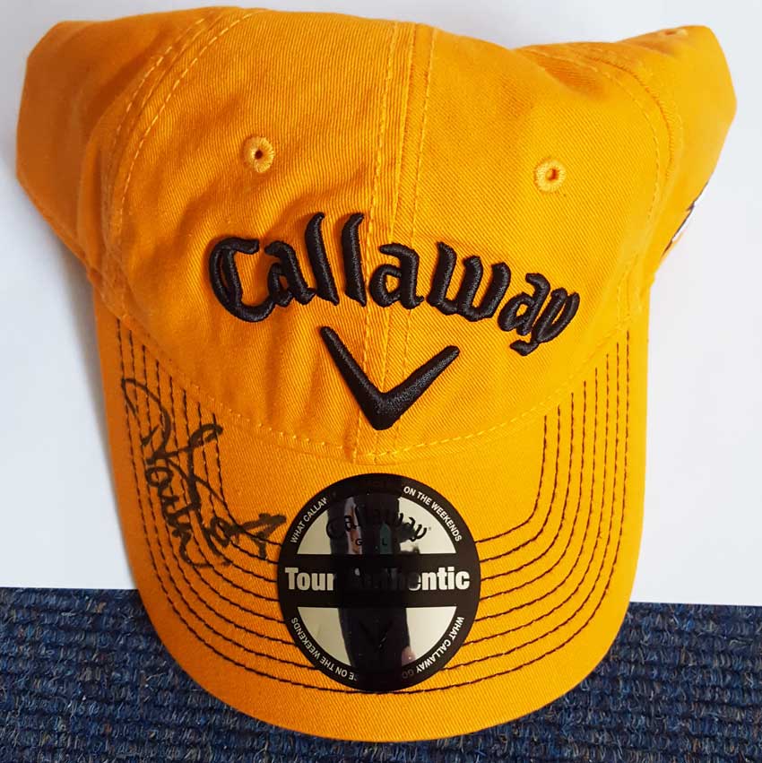 Ian Poulter signed golf cap. Orange official Callaway golf cap autographed on the peak by flamboyant