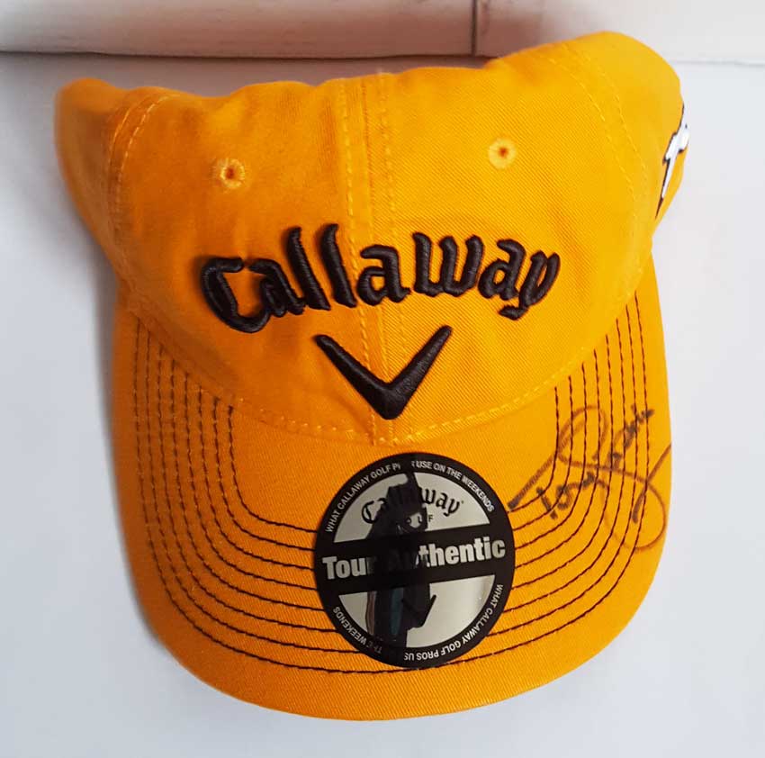 Tony Jacklin signed golf cap. Official orange Callaway golf cap autographed on the peak by Tony