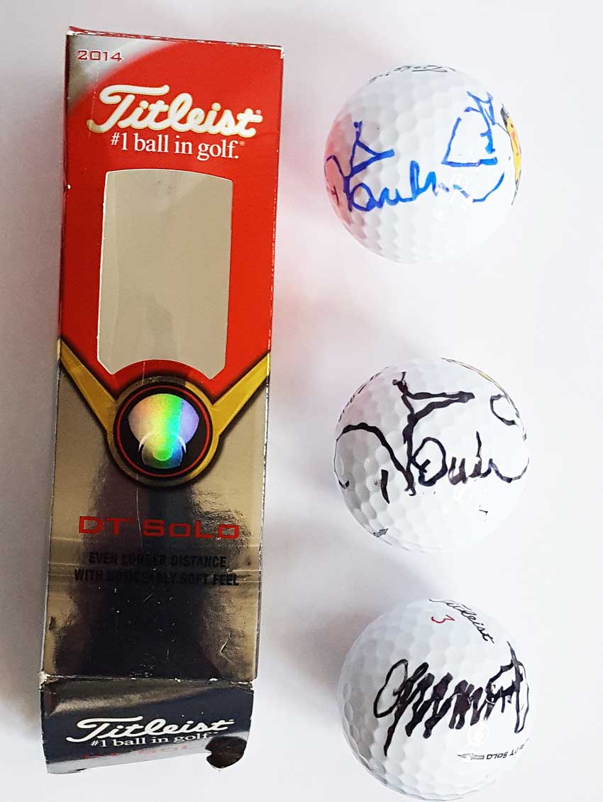 Autographed Golf Ball Collection. Boxed set of three Titleist DT solo golf balls. Two autographed by