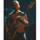 Nate Mendel Foo Fighters signed 10 x 8 inch colour photo playing bass on stage. American bassist for