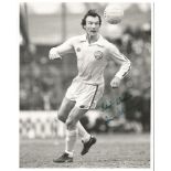 Paul Madeley Signed 1979 Leeds 8X10 Press Photo Good condition. All items come with a Certificate of