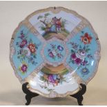 A large late 19th century Dresden deep porcelain dish, decorated in panels with lovers and