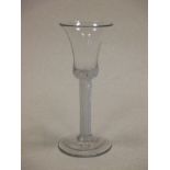 An 18th century wine glass with trumpet bowl on air twist stem, 15.5cm high