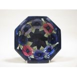 A Moorcroft signed octagonal bowl, early 20th century, pansy design. 25cm diameter