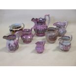 Eight various Sunderland lustre type jugs (8)